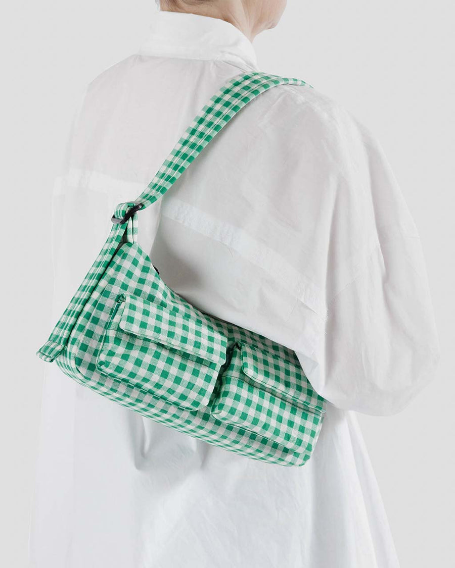 model wearing small green and white gingham cargo baguette bag