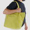 model holding lemongrass cloud bag