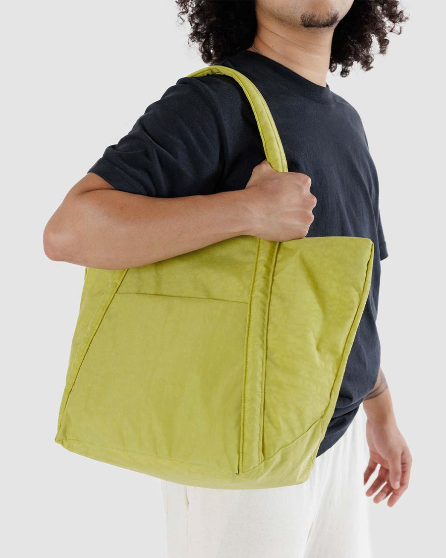 model holding lemongrass cloud bag