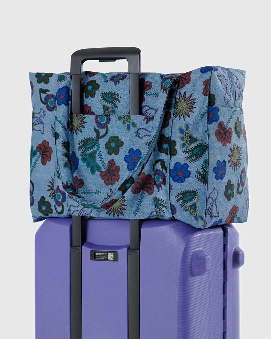 blue digital denim nylon cloud carry on bag with colorful floral and bird print on suitcase