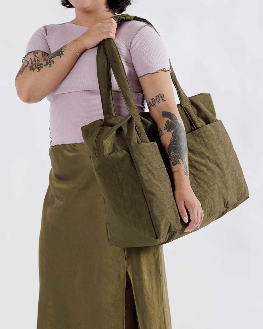 model carrying seaweed cloud carry on bag