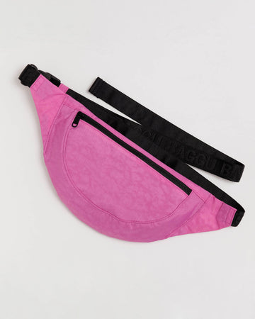 extra pink crescent shaped fanny pack with black strap