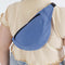 model wearing pansy blue baggu crescent fanny pack