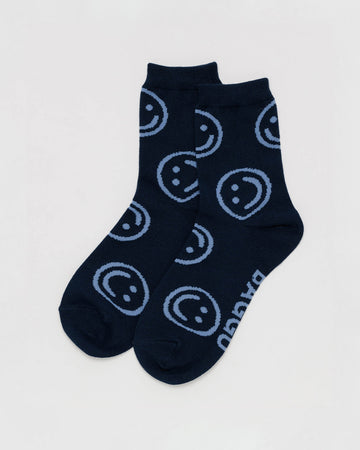 dark navy baggu socks with light blue smiley faces