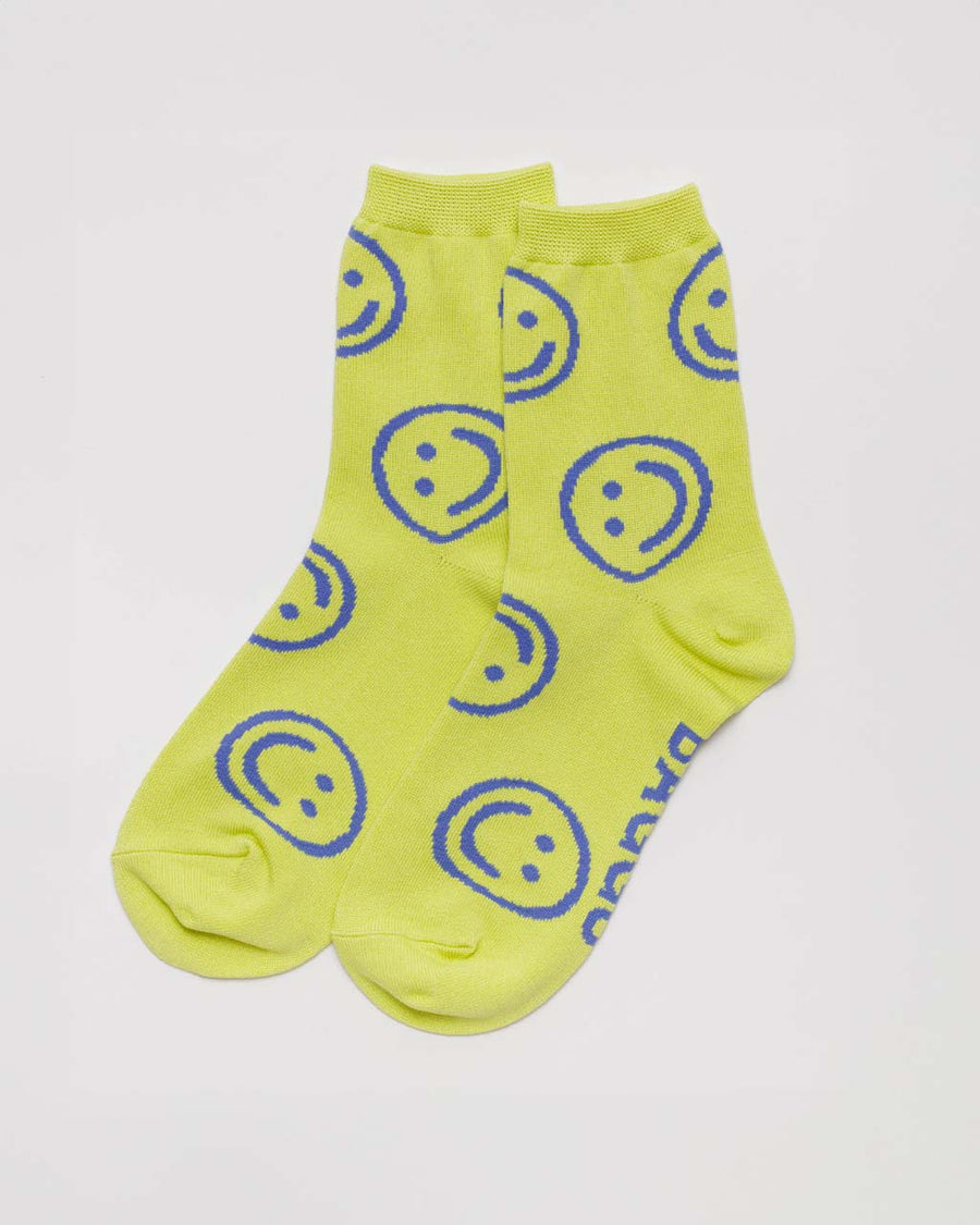 neon yellow crew socks with periwinkle smiley face print