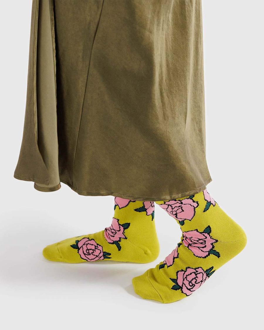 model wearing mustard yellow crew socks with pink rose print