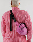 model wearing hot pink nylon fanny pack