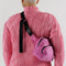 model wearing hot pink nylon fanny pack