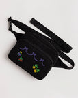 black fanny pack with colorful cross stitch design
