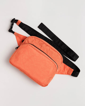 coral orange fanny pack with black strap