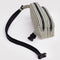 side view of sage and white vertical stripe fanny pack with black strap