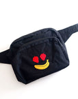 navy fanny pack with strawberry eyes and banana smiley design