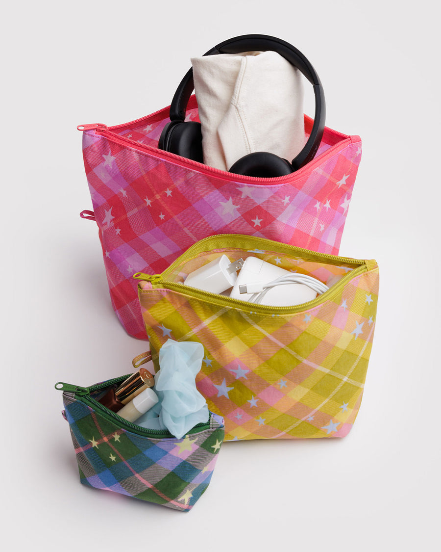 set of 3 go pouch: small blue/green plaid star, medium yellow plaid star, and large pink plaid star with items inside