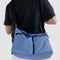 model wearing pansy blue large cargo crossbody bag