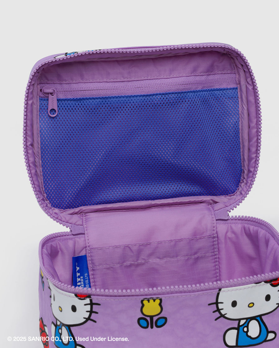 up close of lavender interior of purple large cosmetic bag with hello kitty and yellow tulips print