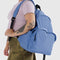 model wearing pansy blue large nylon backpack