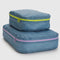set of two large packing cubes in digital denim print with neon zippers