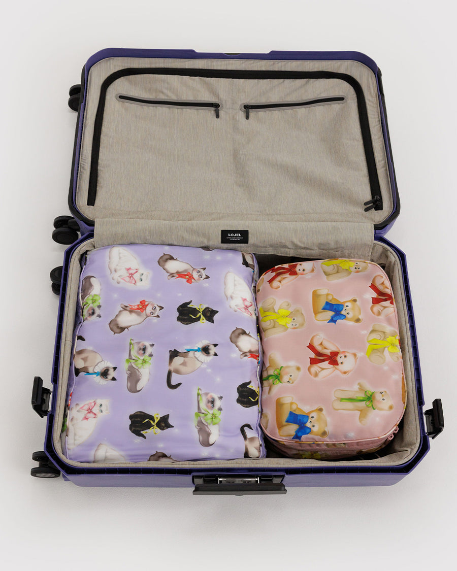 set of 2 large packing cubes: small pink fancy teddy bears, and lilac large fancy cats in a suitcase