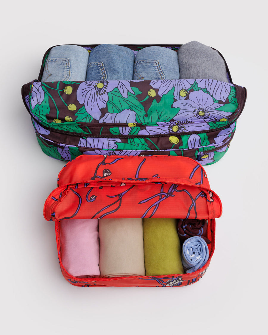 set of 2 large packing cubes: small red snapdragon, and large maroon poppy with clothing inside