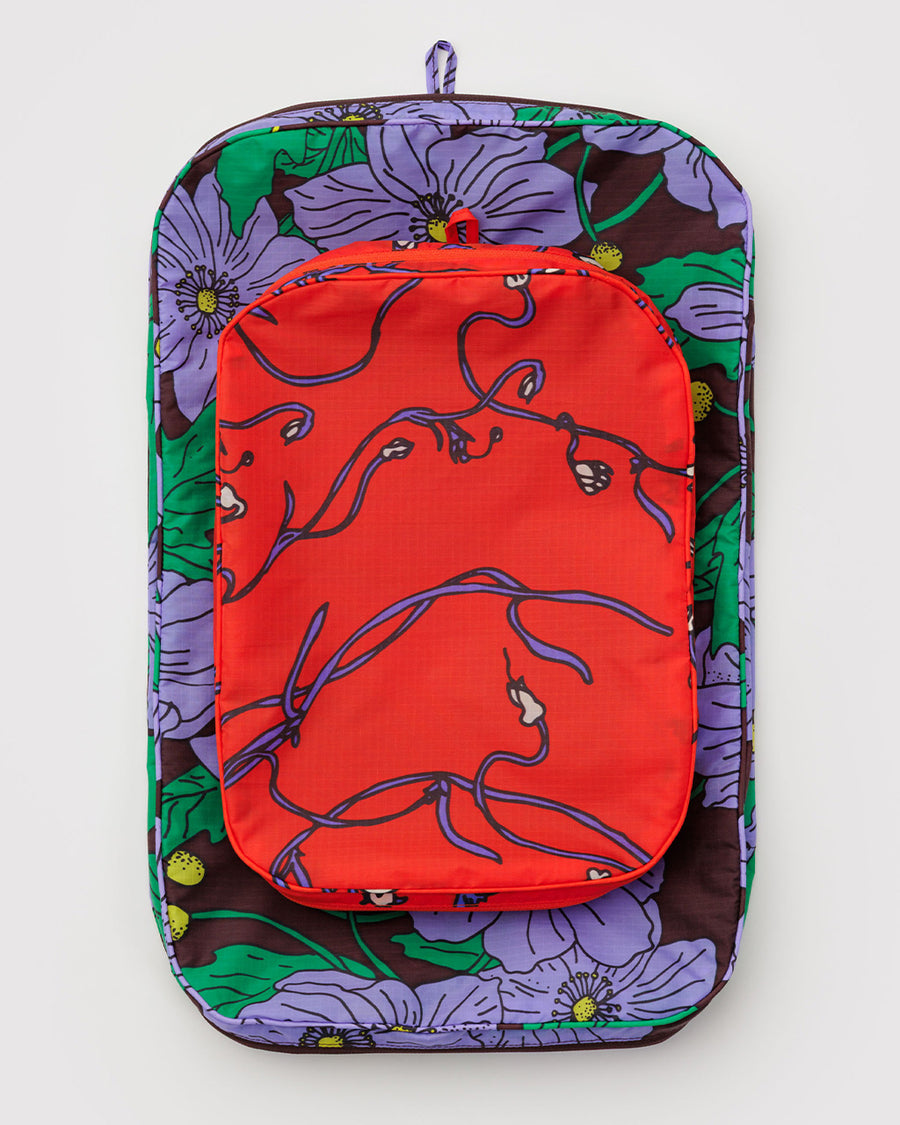 flattened set of 2 large packing cubes: small red snapdragon, and large maroon poppy