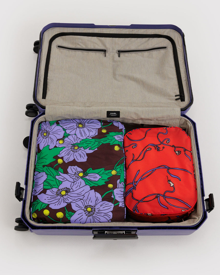 set of 2 large packing cubes: small red snapdragon, and large maroon poppy in a suitcase
