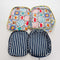 inside of set of two large packing cubes: white and navy stripe and sun and retro vacation tile print