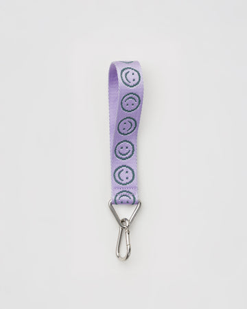 lilac wrist lanyard with green smiley print