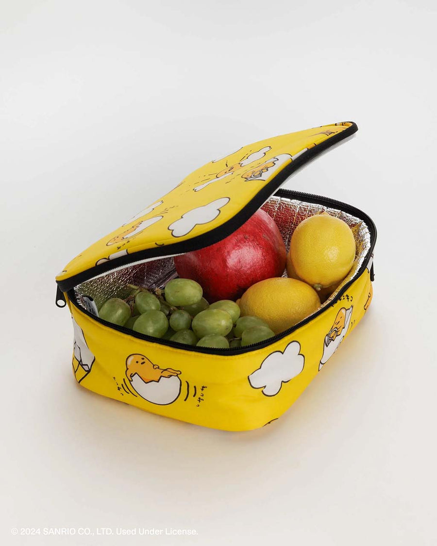 opened yellow gudetama lunch box with fruit inside