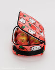 pink baggu lunch box with hello kitty and apple print with apples inside