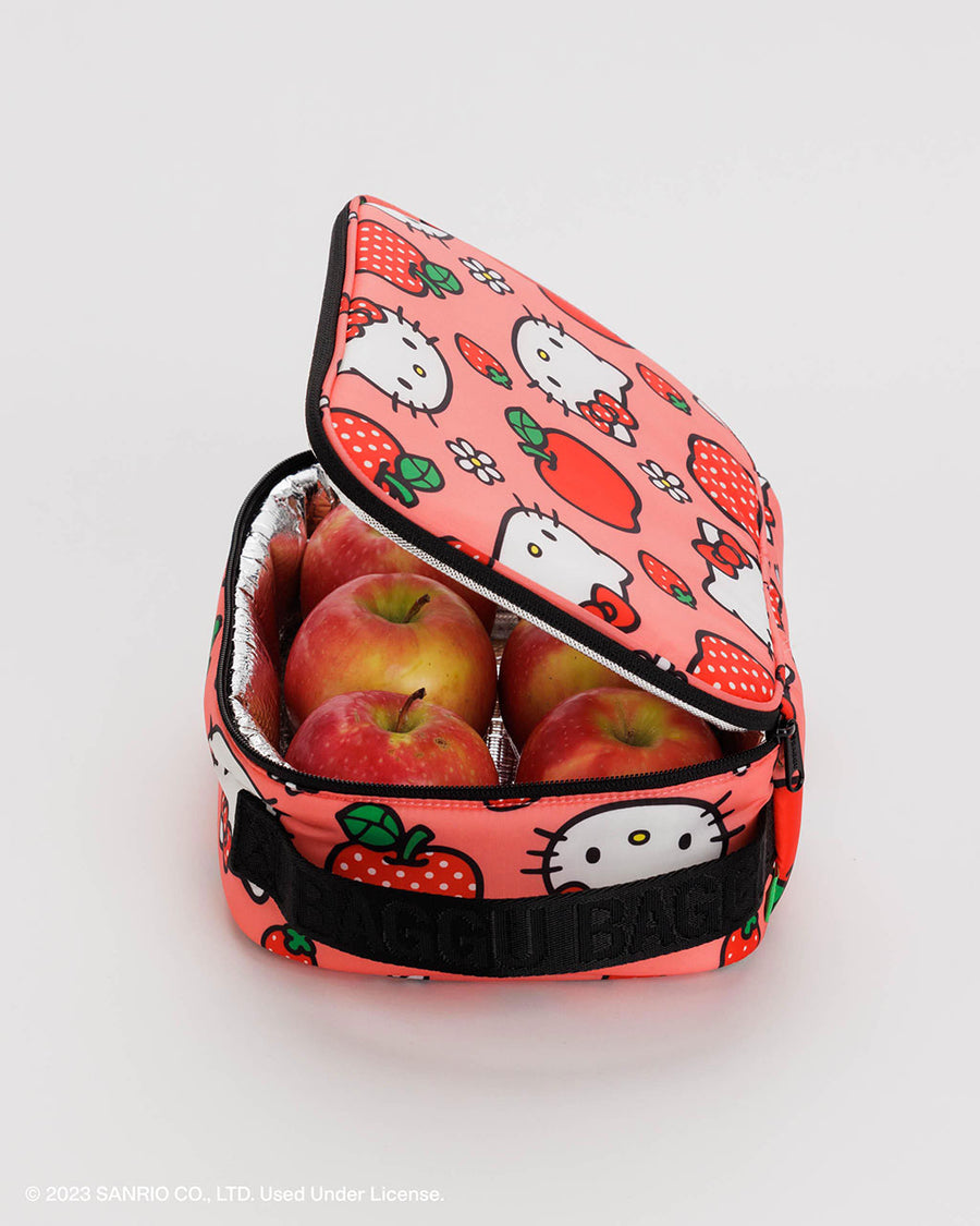 pink baggu lunch box with hello kitty and apple print with apples inside