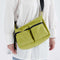 model wearing lime green medium cargo crossbody bag