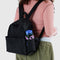 model wearing black medium nylon backpack