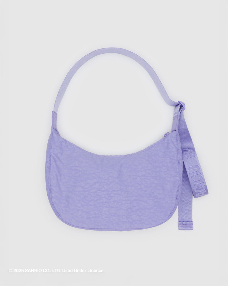 back view of lavender medium nylon crescent bag with embroidered my melody hugging a strawberry and white flower print