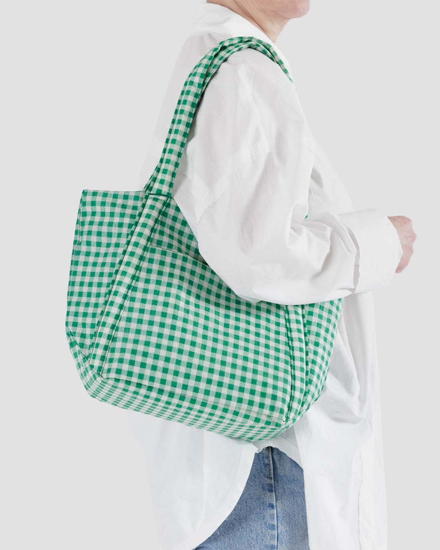 model carrying white and green gingham mini baggu cloud bag
