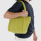 model carrying lime green mini baggu cloud bag