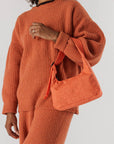 model holding coral mini nylon shoulder bag