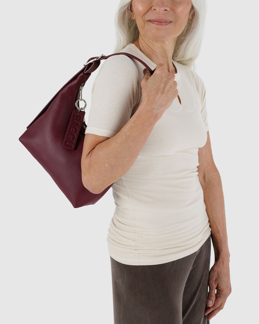 model carrying mahogany recycled leather mini nylon shoulder bag with matching strap and trim