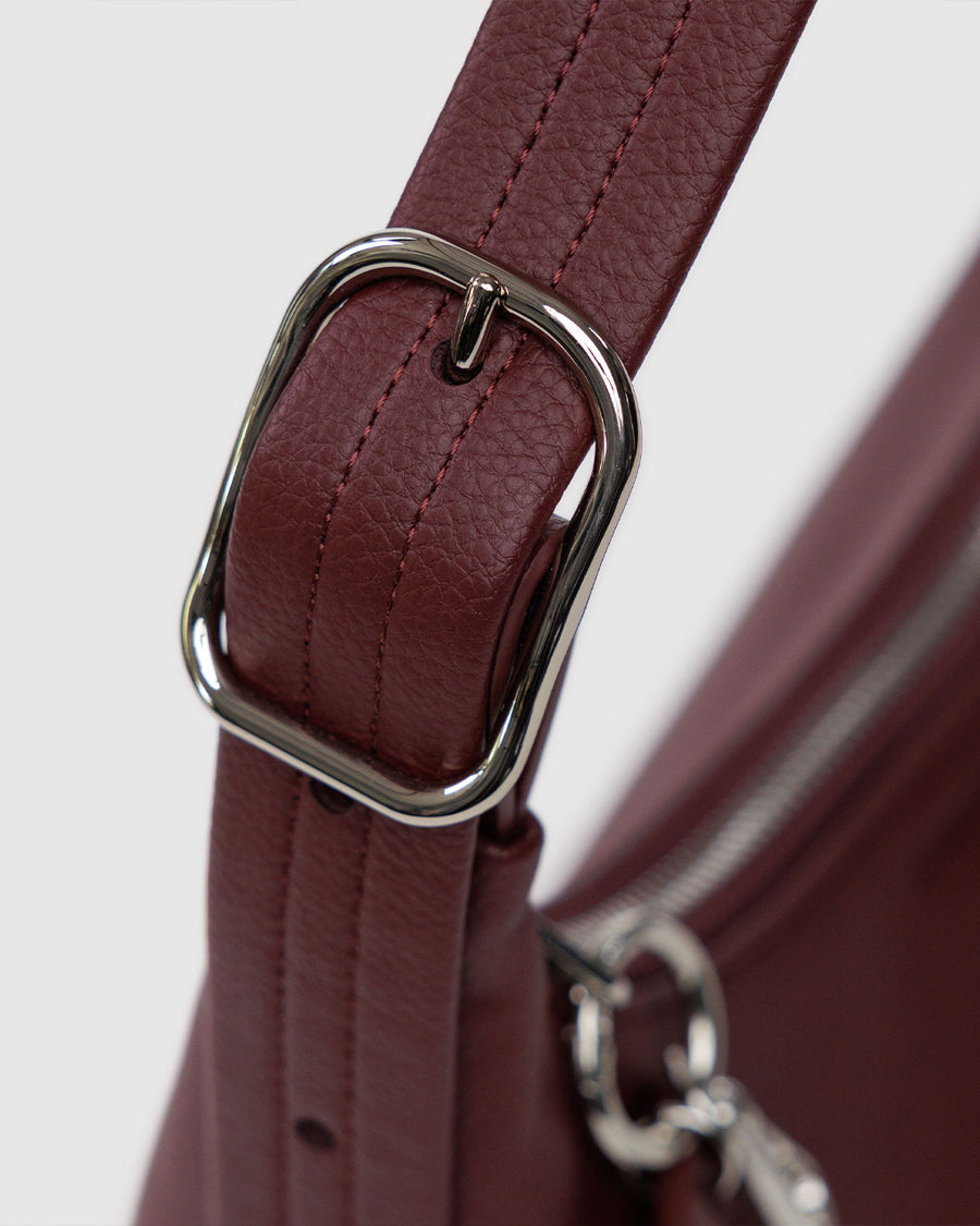 up close of silver buckle on adjustable strap