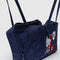 side view of navy nylon bowler bag with embroidered hello kitty talking on a red phone