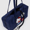black interior key leash of navy nylon bowler bag with embroidered hello kitty talking on a red phone