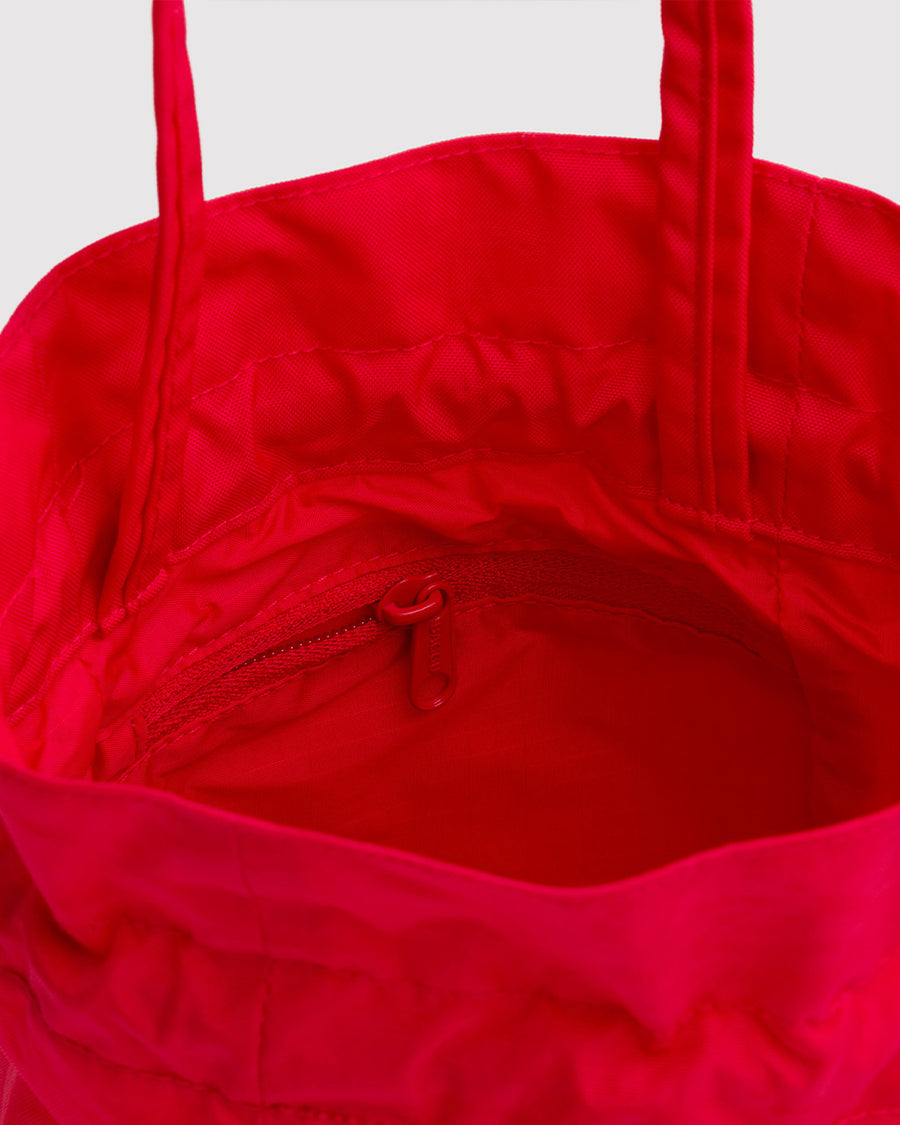 interior of red drawstring bag with handle