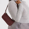 model carrying nylon mahogany pochette bag with smiley charm and adjustable shoulder strap