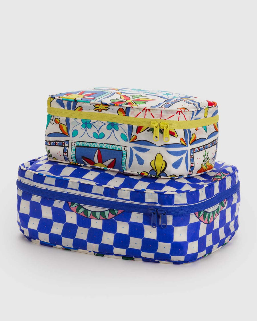 set of 2 packing cubes: white vacation tiles and blue checkered cherry print