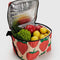 light pink puffy cooler with large strawberry print with fruits and veggies inside