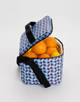 blue and brown wavy gingham puffy cooler bag with oranges inside
