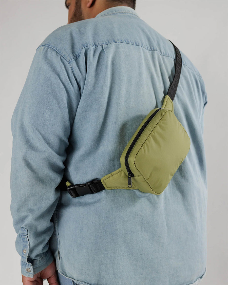 model wearing olive green puffy fanny pack