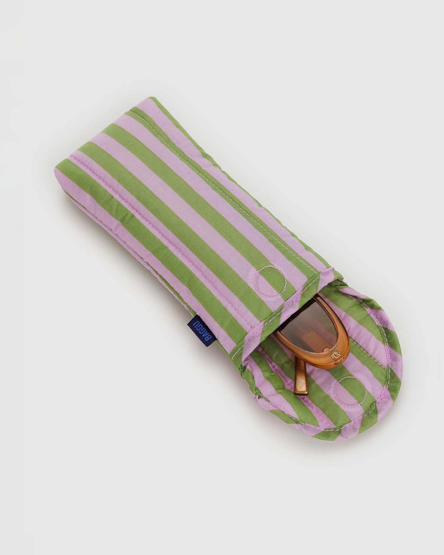 opened puffy eyeglass sleeve with pink and avocado vertical stripes with sunglasses inside