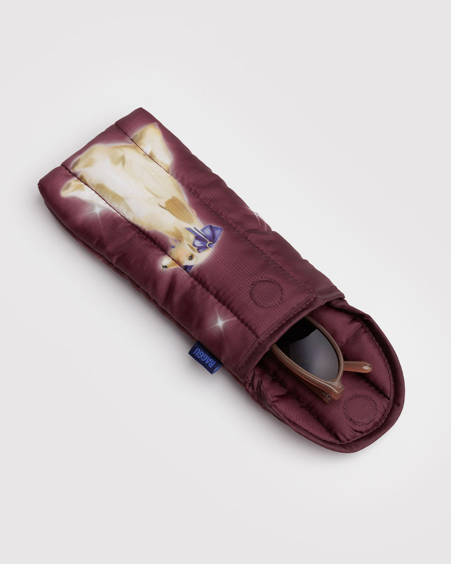 maroon puffy eyeglass sleeve with a fancy dog on it with sunglasses inside