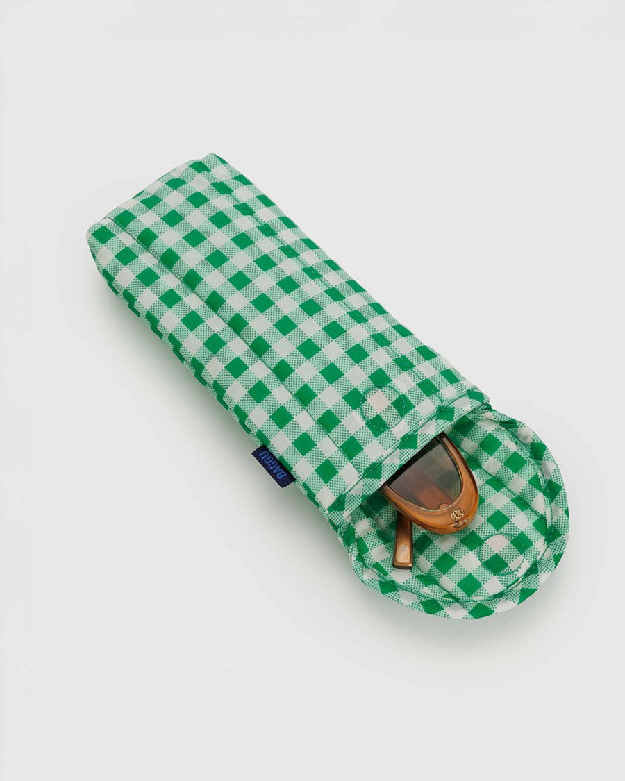 open green and white gingham puffy eyeglass sleeve with sunglasses inside