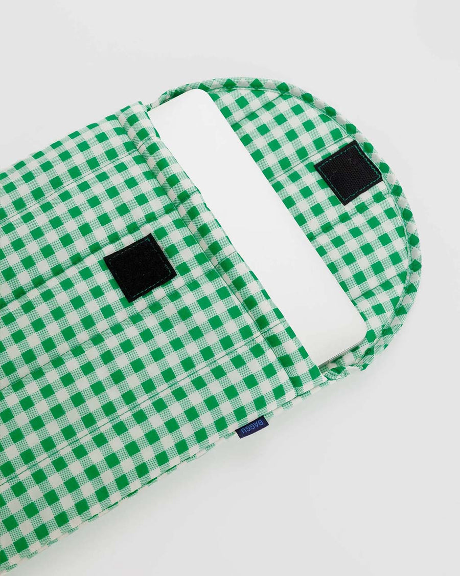green and white gingham 13 in. puffy laptop sleeve with laptop inside